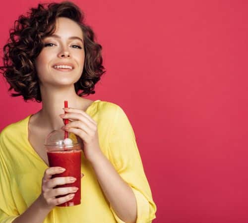 Woman enjoying a protein smoothie
